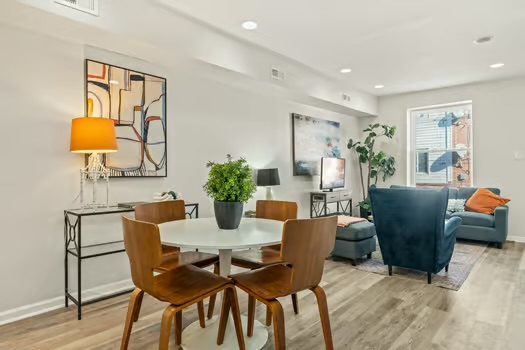 Open living and dining area with a round table